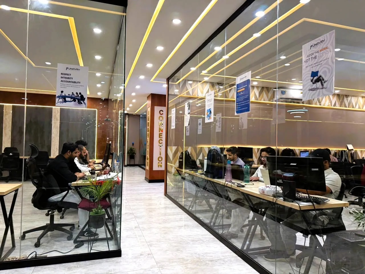 The Funavry office floor, with the team at their desks behind glass partitions