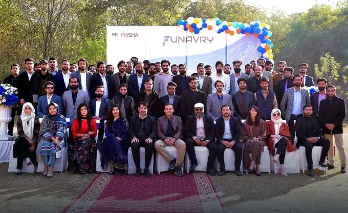 The Funavry team seated and standing in rows before a Funavry and P@SHA backdrop at an outdoor event
